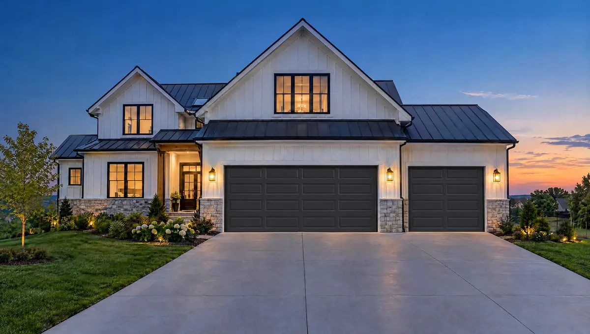 Classic Raised Panel garage doors on a white farmhouse