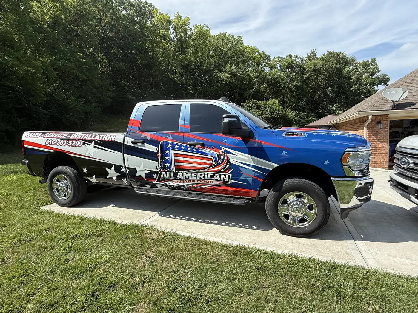 All American Garage Door wrapped service truck, view 1
